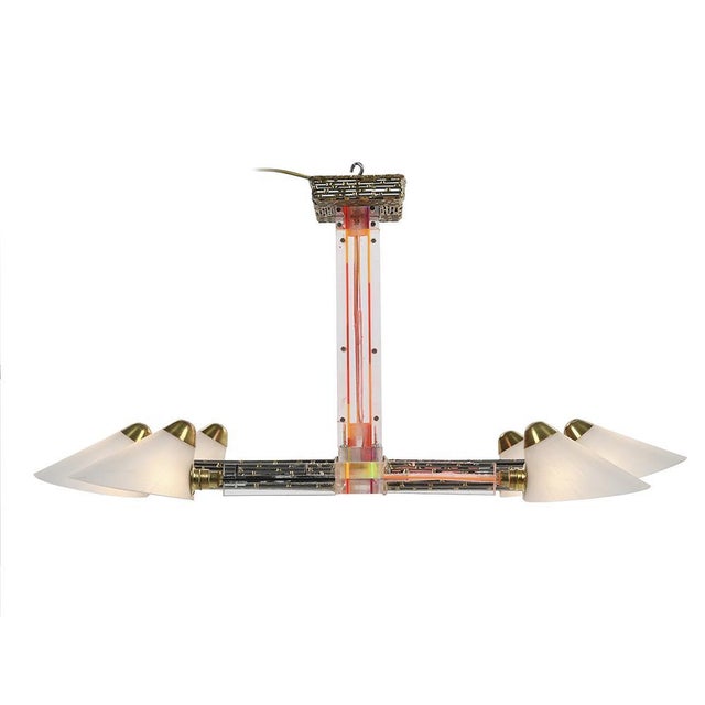 Resin and brass chandelier signed Henri Fernandez. This piece is designed in the style of the selected designer and/or...