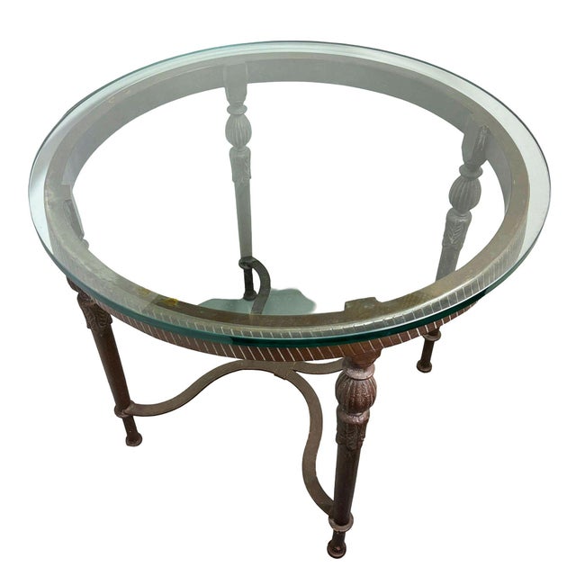 Late 20th century Louis XVI high style bronze accent table with round glass top. Designed with a sophisticated...