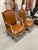 A beautiful pair of 19th century Louis XV Bergeres upholstered in Leather and woven grasscloth. The painted surfaces have...