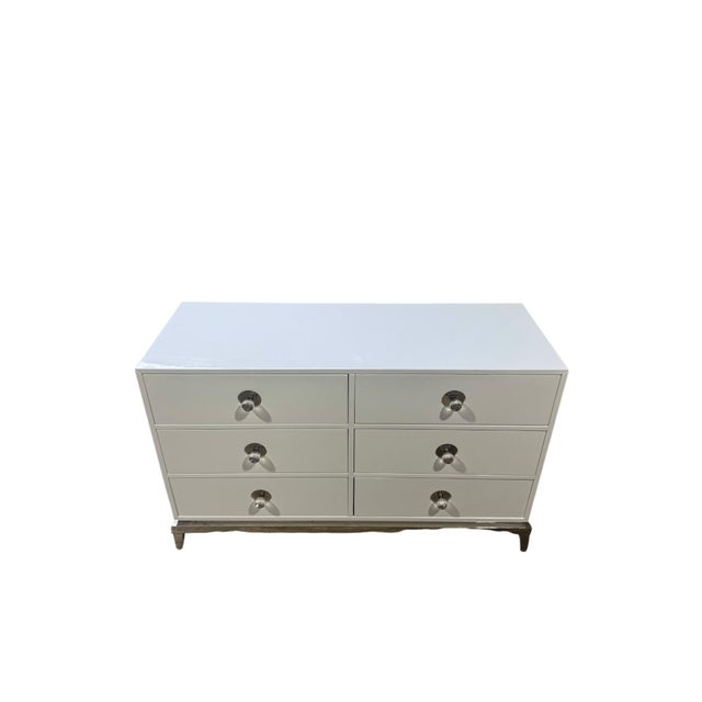 A well-made and straightforward 6 drawer dresser / chest of drawers by Jonathan Adler. This "Channing" model rests on a...