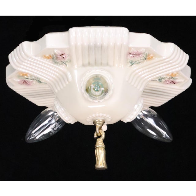 Vintage three exposed bulb light porcelain flush mount ceiling fixture from the 1930s. This requires three standard Edison...