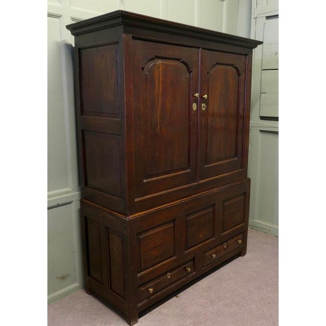 A Spacious Georgian Oak Housekeepers or Cloakroom Cupboard This is an Old and roomy cupboard it has panelled Oak doors,...