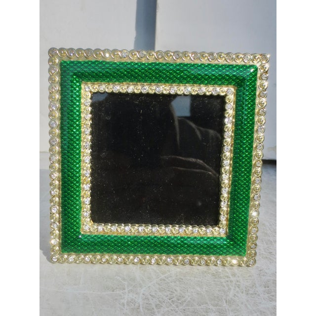 Jewel-like green enamel set in a brass frame mounting. Glowing emerald green with borders of alternating rhinestone and...