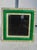 Jewel-like green enamel set in a brass frame mounting. Glowing emerald green with borders of alternating rhinestone and...