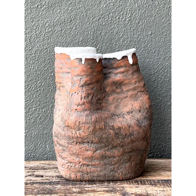Dated 1972, this vintage studio pottery vase is a striking example of the organic and sculptural ceramic movement that...