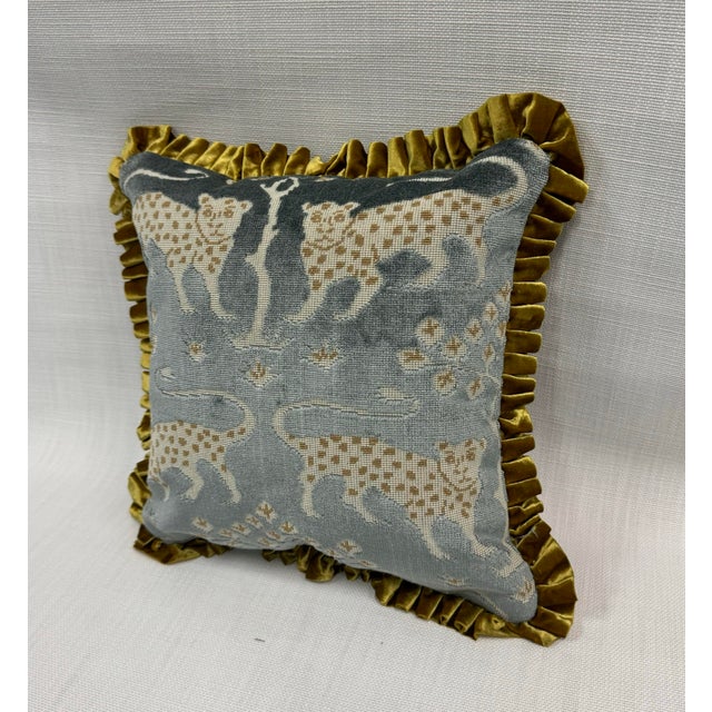 Handmade pillow in Schumacher’s Woodland Leopard, Mineral colorway (front). We used a textural weave in old gold for the...