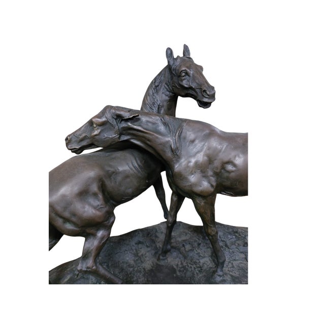 This sculpture is a refined group in dark patinated bronze, the work of French artist Pierre-Jules Mène (signed "P.J....