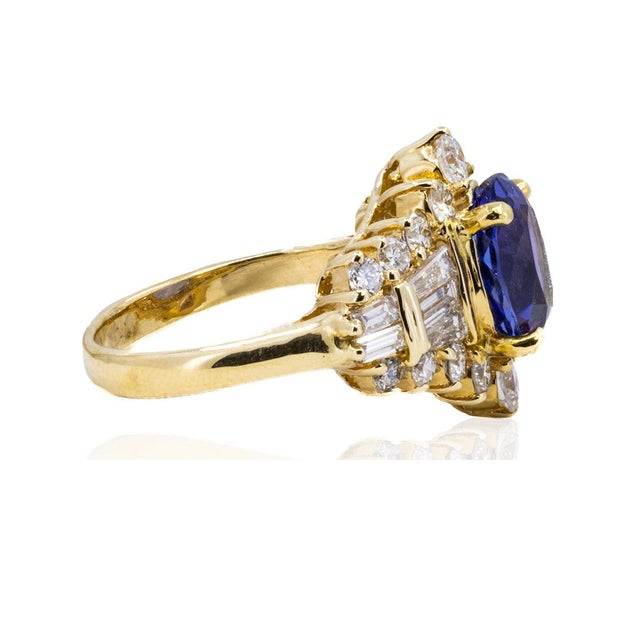 Add a pop of color to any outfit with this oval Tanzanite Ring. Its vibrant hue will make you stand out in any crowd (and...