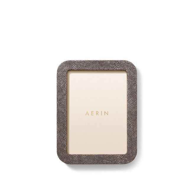 This contemporary frame is finished with textured, embossed Faux Shagreen and is styled with curved lines. The minimalist...