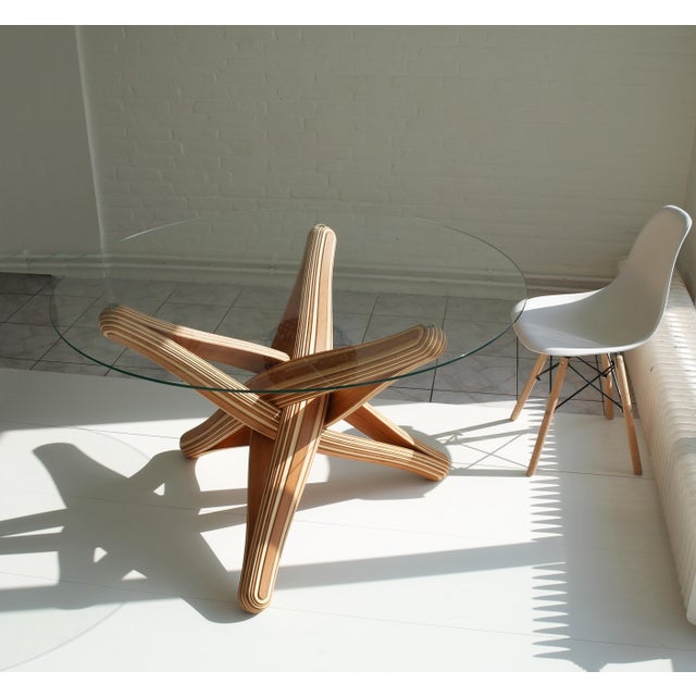 “lock” dining table base (glasstop not included!) designed out of the qualities, possibilities and characteristics of its...