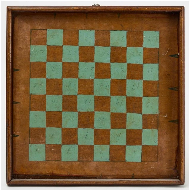 The *Americana Parcheesi Gameboard with Checkers on the Reverse* from 1900 is a stunning example of early 20th-century...