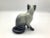 A very cute derivative ceramic mid century siamese cat figurine. The cute cat has stunning blue eyes. The Siamese cat is...