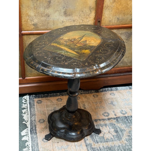 Design Plus Gallery presents a Tilt Top Pedestal Table from the 19th Century. The table has a glossy black lacquered...