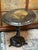 Design Plus Gallery presents a Tilt Top Pedestal Table from the 19th Century. The table has a glossy black lacquered...