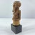 This hand-carved wooden figure is attributed to the Kusu people of the Democratic Republic of the Congo, a region renowned...