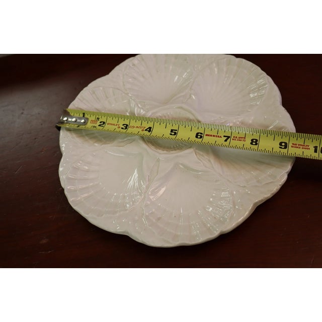 Add a touch of classic French elegance to your table with this beautiful vintage Sarreguemines majolica oyster plate....