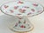 Elegant 7-piece antique Limoges dessert set with hand-painted roses and gilt edges, retailed by Leveillé, Paris. Elevate...