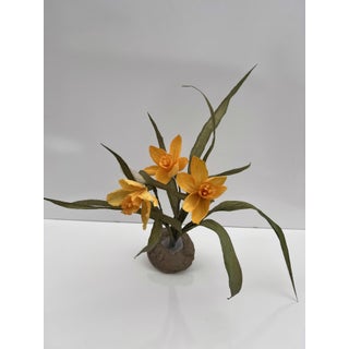 Foreshadow III by Ashley Folkner | Cement and wood sculpture of yellow flowers with leaves For Sale