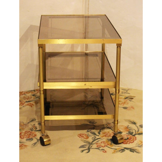 Mid Century Modern brass & glass trolley, circa 1970. 3-tier trolley or bar cart - also great as a side table. Eglomise...