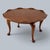 wonderfully unusual 1970s solid teak coffee table, defined by its sculptural, organic form and distinctive lotus-inspired...