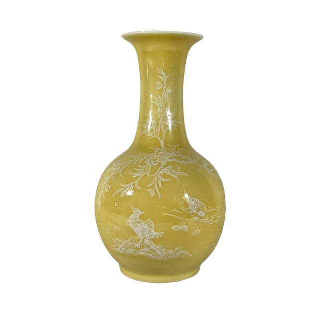 From the area of Jingdezhen, a yellow Monochrome vase with very fine pate sur pate white glaze decoration of little birds...
