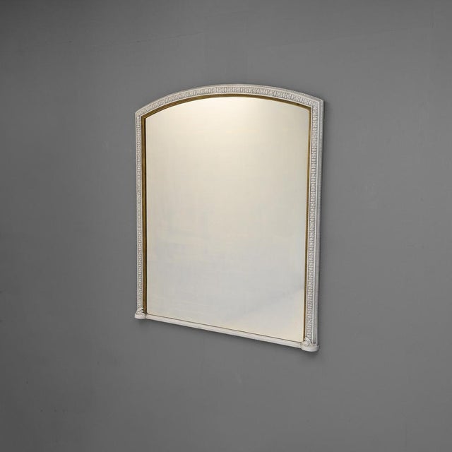 Overmantel mirror with original plate and gilding in repainted finish. Circa 1890.