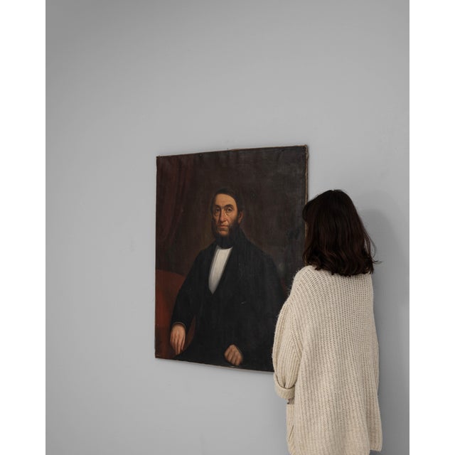 This 19th Century French painting captures the quiet dignity and formal presence characteristic of provincial portraiture...