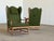 A substantial and imposing pair of Danish wingback armchairs constructed in solid oak and upholstered in their original...