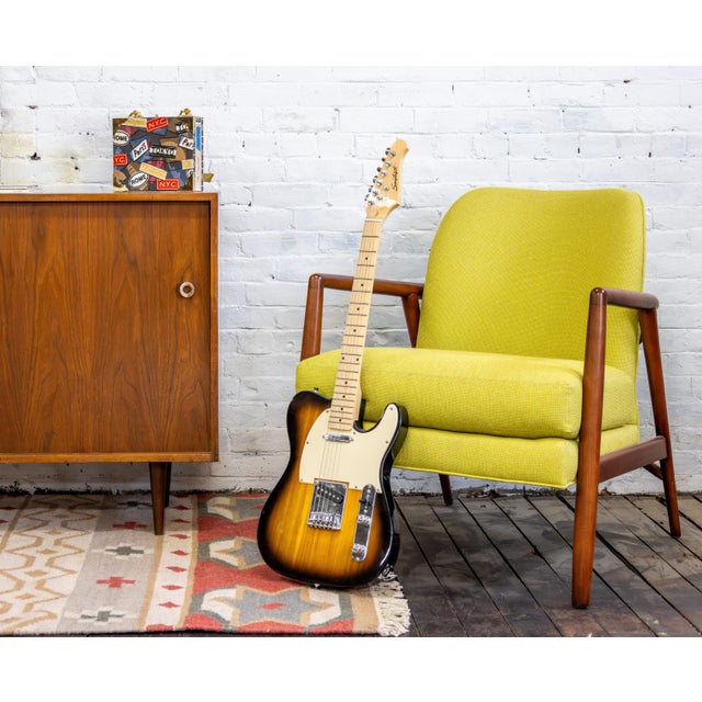 This is a Thayer Coggin private label style lounge chair in cherrywood. In its most current version it's the Thayer Coggin...