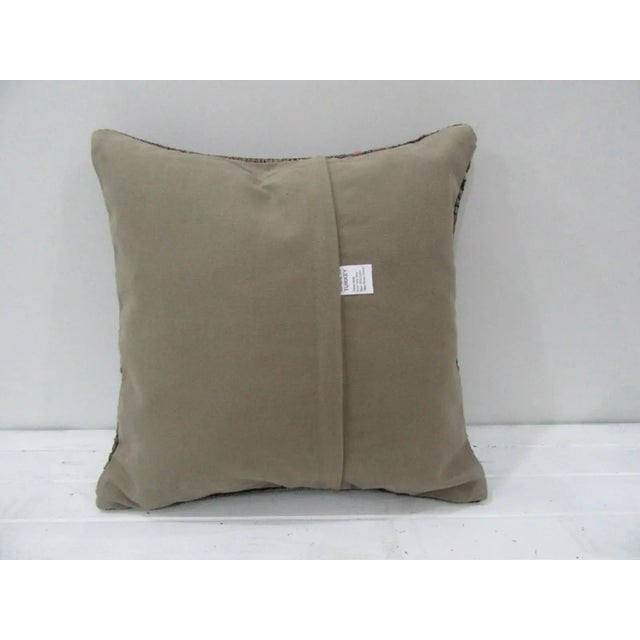 This is a pillow cover made from a vintage kilim rug. The piece was properly washed and ready to use. Pillow inserts not...