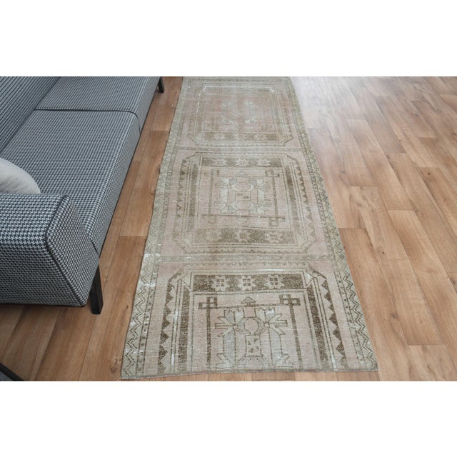 This vintage hand-knotted area rug is a semi-antique vintage area rug. The '70s Eastern region of Anatolian's unique rug...