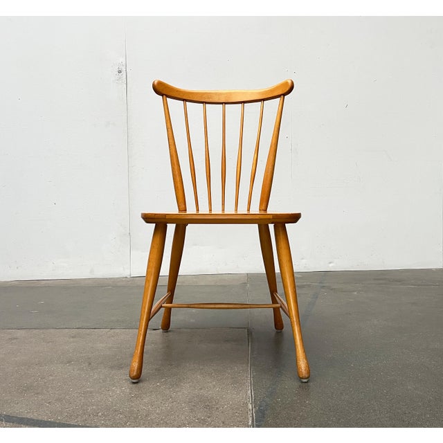 Two rare mid-century rung chairs from Casala. A classic Windsor chair design in Scandinavian style. This is evident in the...