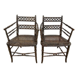 Pair of Regency Style Faux-Bamboo Faux-Painted Caned Seat Arm Chairs by Baker Furniture. For Sale