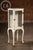 Tall porcelain-enamel and steel dental cabinet on cabriole metal legs, originally designed for organizing instruments,...