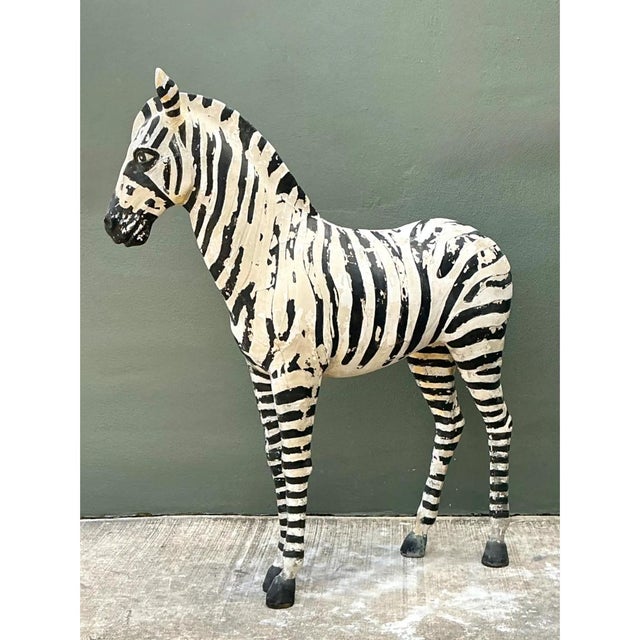 This vintage life-size sculpture captures a young zebra in a poised, naturalistic stance, its slender legs planted wide,...