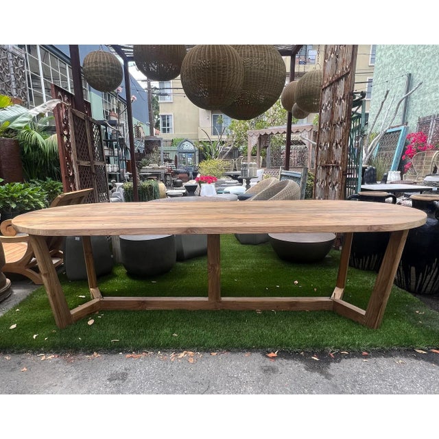 Hand crafted large vintage teak wood dining table in midcentury modern inspired oval shape. Perfect for outdoor or indoor...