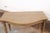 A charming French wooden console table, with bow-front design, from the late 19th century. This antique table from France...