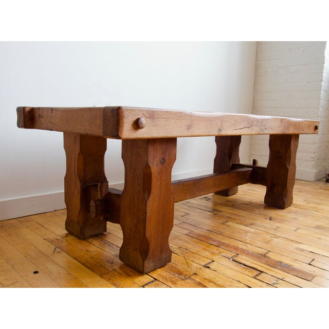 Substantial French oak coffee table in the Brutalist style, built from heavy carved planks with a strong, sculptural...