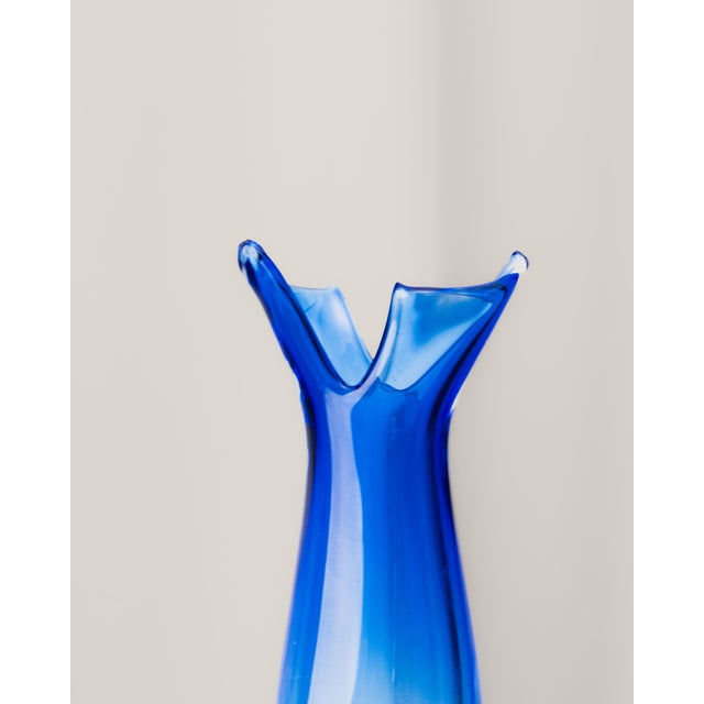 Blue Murano glass vase and clear glass vase by Luigi Onesto. Shaped like a flower vase with an open mouth. Signed on the...