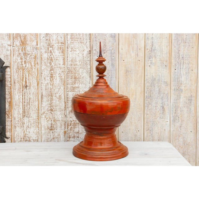 Lustrous Burmese temple food offering vessel with its original lacquer finish in red with multiple components. It was made...