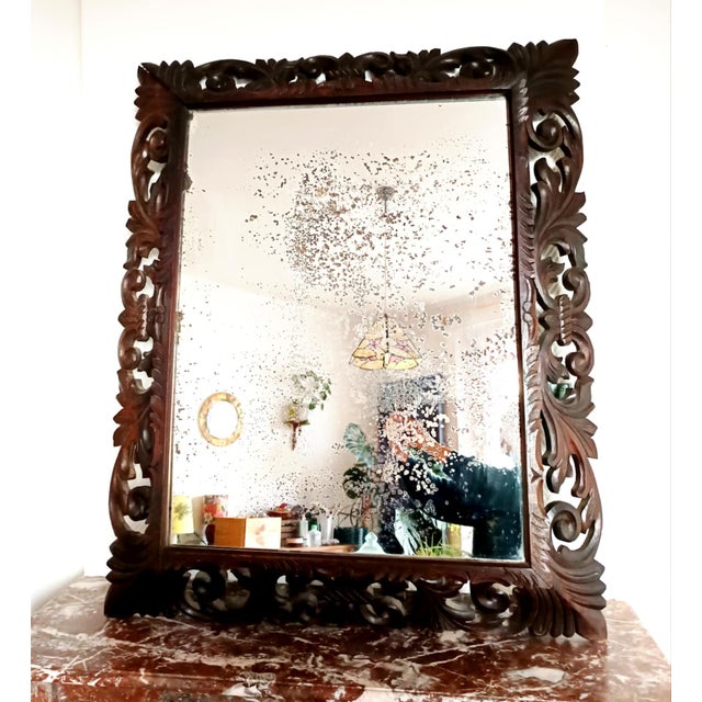 Large carved oak mirror, Neo-Gothic style, circa 1940. Large mirror, mercury glass, fully backed. Decorated with acanthus...