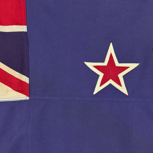 This vintage New Zealand flag is made from a cotton cloth, with fully sewn stars and printed Union Jack. Please note...