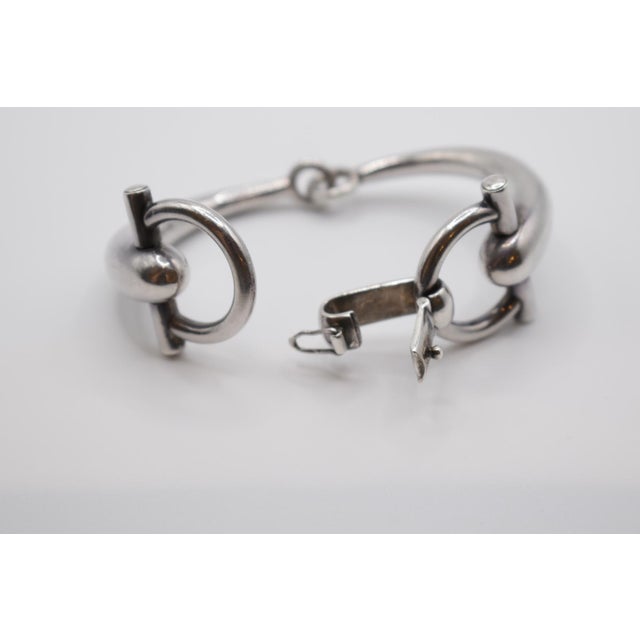 This is a beautiful Gucci horse bit bracelet in sterling silver. It is marked Gucci, 925, Italy