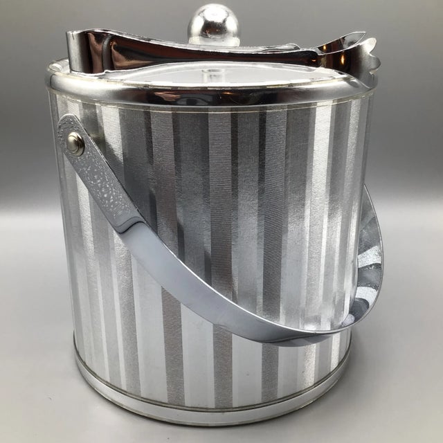 Here is an ice bucket that has an industrial look. With the handle up 12 3/4 inches high. Inside measurements are 6 1/2...