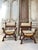 Pair of Renaissance-style walnut ceremonial armchairs, circa 1880. Curule-shaped, they feature carved faun heads on the...