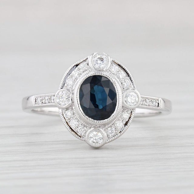 Gemstone Information: - Natural Sapphire - Carats - 0.75ct Cut - Oval Color - Dark Blue Treatment - Heated - Natural...