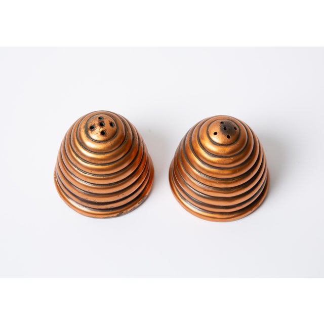 Early Mid-Century Art Deco honeybee hive shaped salt and pepper shaker set by Jennings Brothers. These are a rare find!...