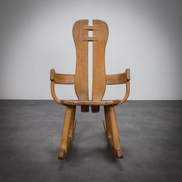 A rare brutalist rocking chair by belgian designer de puydt, crafted from solid oak in the 1970s. Defined by its...