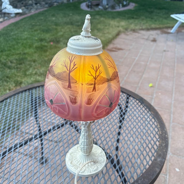 Art Deco Boudoir Lamp with pink and yellow reverse painted shade. This lamp has a painted metal body that show wear...