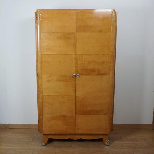 An Art Deco wardrobe attributed to Jules Leleu. Satinwood with brass detail to corners and original capped feet....